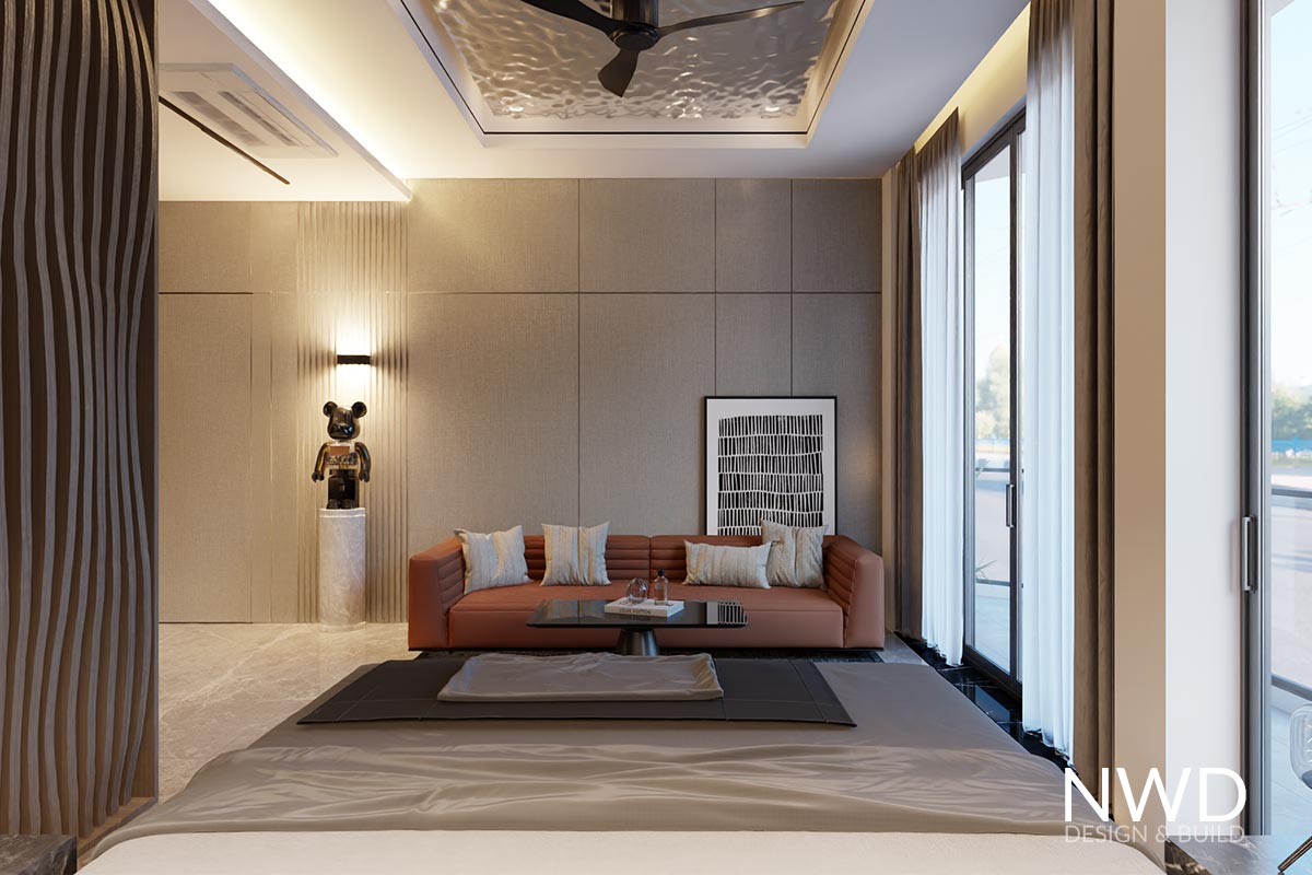 Phòng Master có bố trí Sofa thư giãn và vách ốp kết hợp cửa bí mật đi vào nhà vệ sinh